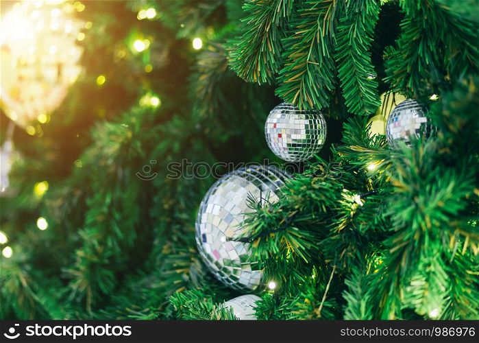 Closeup of Colorful balls on Green Christmas tree background Decoration During Christmas and New Year.
