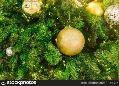 Closeup of Colorful balls on Green Christmas tree background Decoration During Christmas and New Year.
