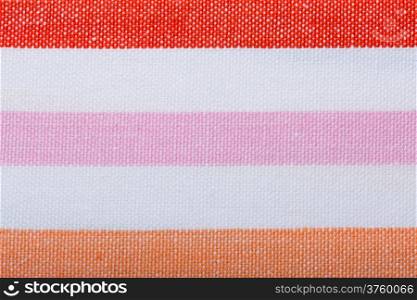 Closeup of colorful horizontal striped fabric textile as background texture or pattern. Macro.