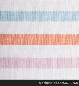Closeup of colorful horizontal striped fabric textile as background texture or pattern. square format. Macro.