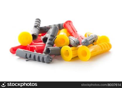 Closeup of colorful plastic dowels isolated on white background.