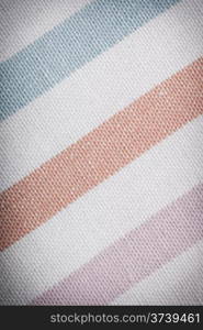 Closeup of colorful striped fabric textile as background texture or pattern. Macro.
