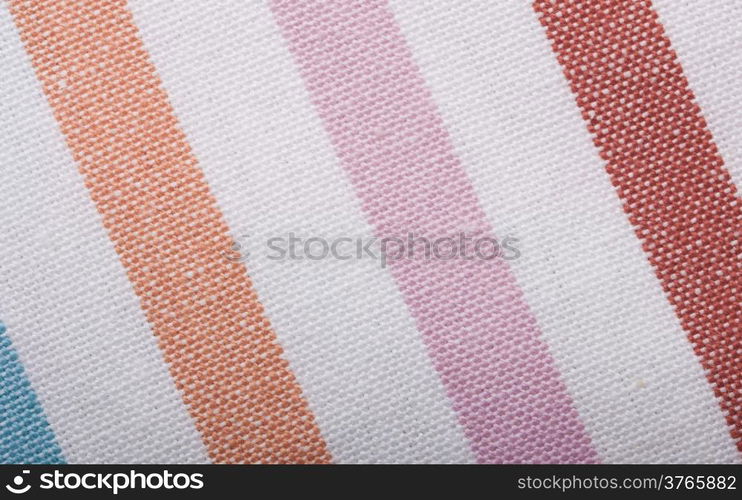 Closeup of colorful striped fabric textile as background texture or pattern. Macro.