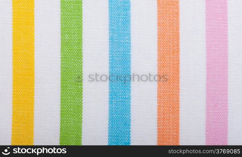 Closeup of colorful striped fabric textile as background texture or pattern. Macro.