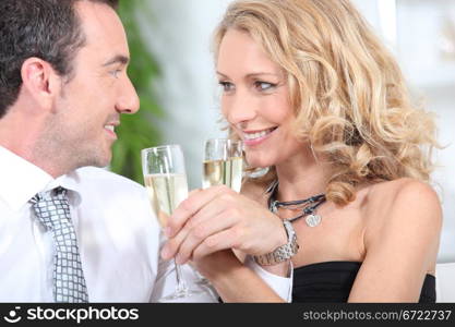 Closeup of couple drinking champagne