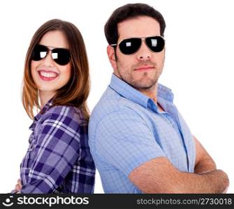 closeup of couple wearing sunglasses standing back to back