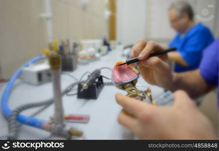 Closeup of dental technician in laboratory