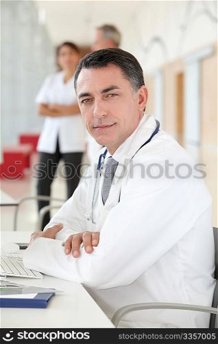 Closeup of doctor sitting in his office