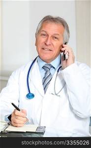 Closeup of doctor talking on the phone in the office