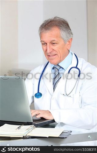 Closeup of doctor working on computer in the office