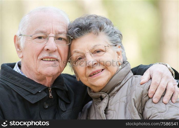 Closeup of elderly couple cuddling