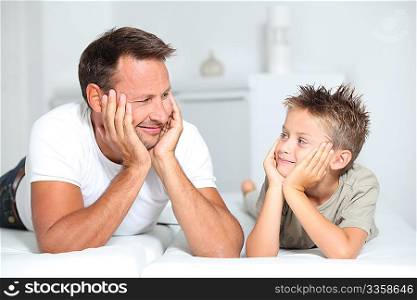 Closeup of father and son at home