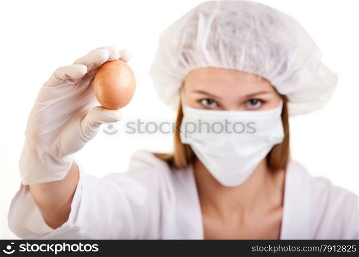 Closeup of Female Scientist Showing an Egg