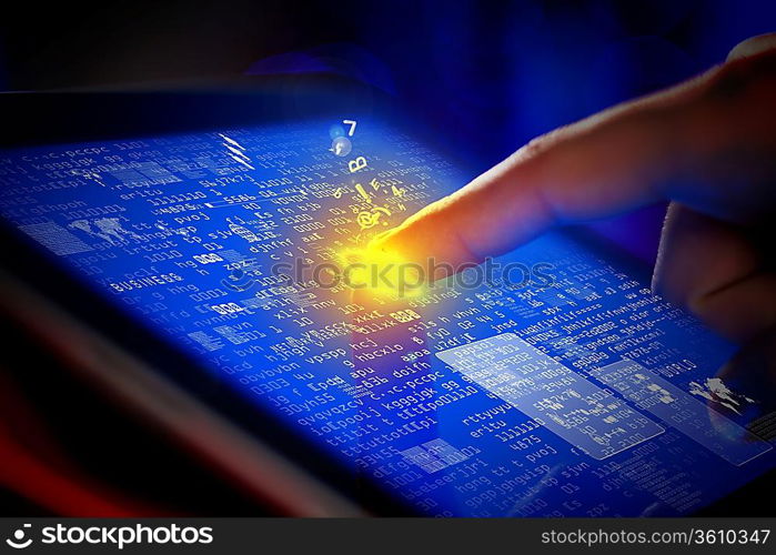 Closeup of finger touching blue toned screen on tablet-pc