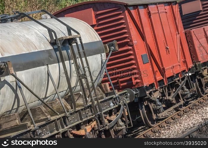 closeup of freight wagons on a railroad track