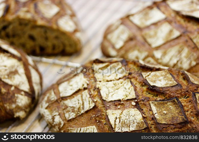 Closeup of fresh baked brown bread. Selective focus.