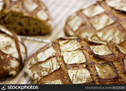 Closeup of fresh baked brown bread. Selective focus.
