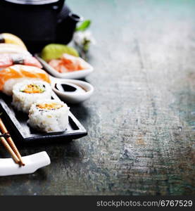 Closeup of fresh sushi on rustic wooden table