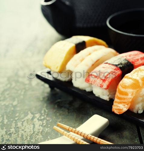 Closeup of fresh sushi on rustic wooden table