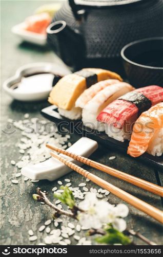Closeup of fresh sushi on rustic wooden table, close up. Closeup of fresh sushi on rustic wooden table