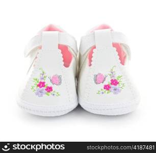 Closeup of girl baby shoes isolated on white background