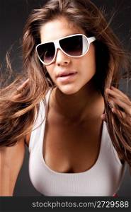 closeup of Glamour woman with sunglasses on black background