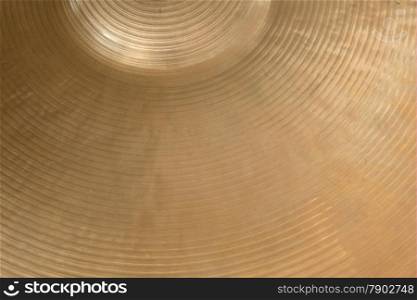 closeup of gold colored cymbal on horizontal picture