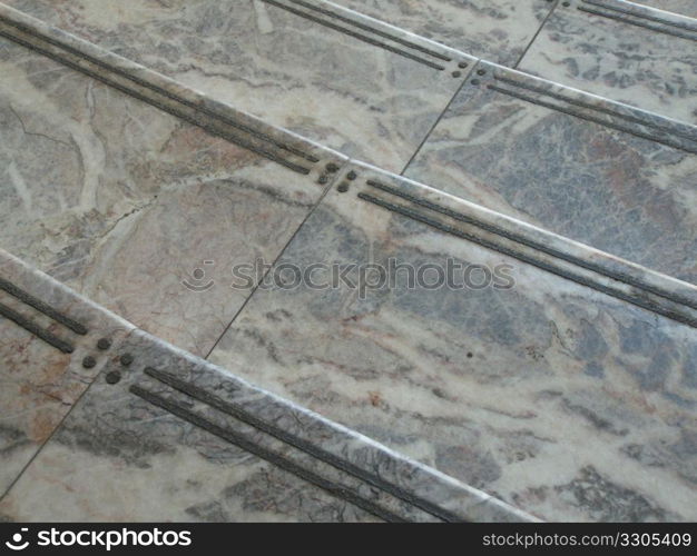 closeup of grey marble steps leading down
