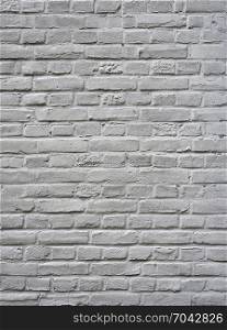 closeup of grey painted vertical part of brick wall