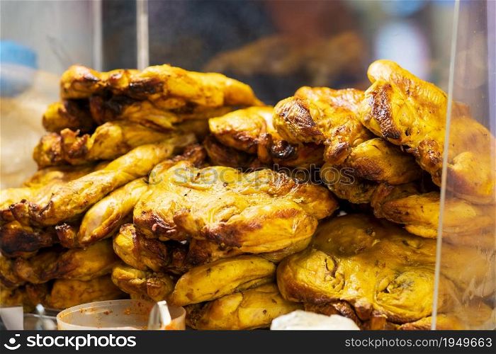 Closeup of Grilled chicken with turmeric, thai street food market