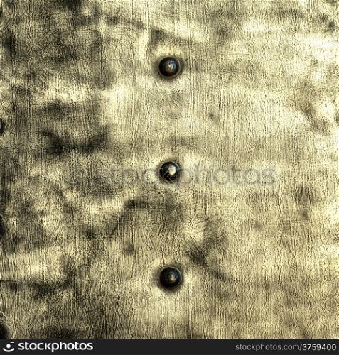 Closeup of grunge gray grey metal plate with rivets and screws as background or texture. Square format.