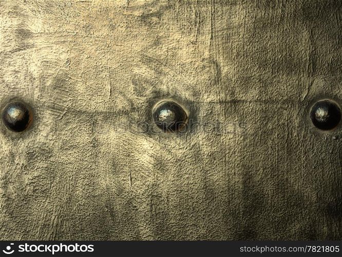 Closeup of grunge gray grey metal plate with rivets and screws as background or texture