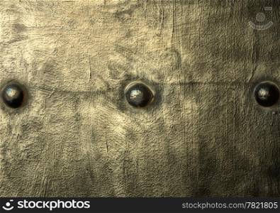 Closeup of grunge gray grey metal plate with rivets and screws as background or texture