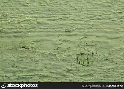 closeup of grunge green painted, rough wood background