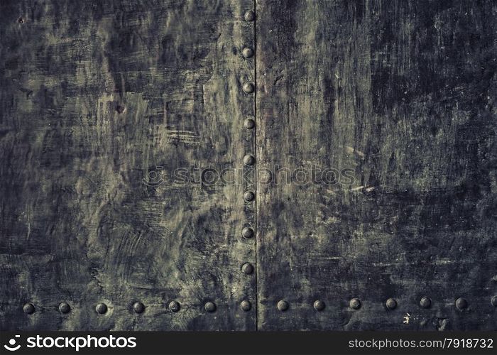 Closeup of grunge old black metal plate as background or texture