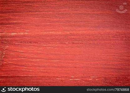 closeup of grunge red painted, rough wood background