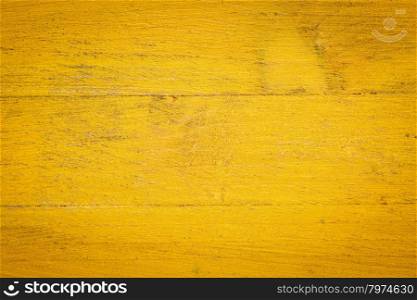 closeup of grunge yellow painted, rough wood background