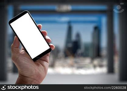 Closeup of Hand holding Blank Screen of Smart phone with blurred background as concept