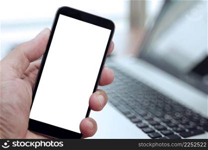 Closeup of Hand holding Blank Screen of Smat phone with blurred background as concept
