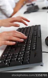 Closeup of hands on computer keyboard
