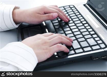 Closeup of hands typing on keyboard