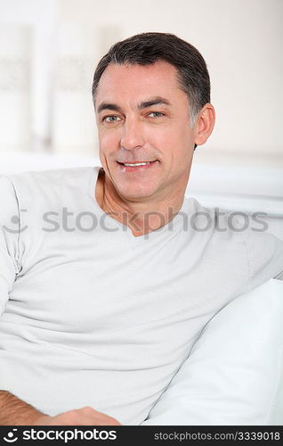 Closeup of handsome man relaxing in sofa