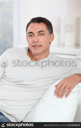 Closeup of handsome man relaxing in sofa