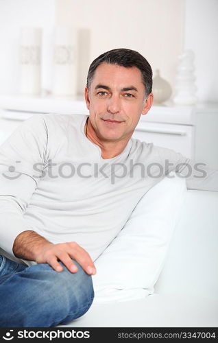 Closeup of handsome man relaxing in sofa
