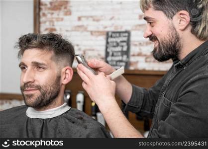Closeup of happy man getting an haircut, in hair salon. High quality photo.. Closeup of happy man getting an haircut, in hair salon. High quality photo