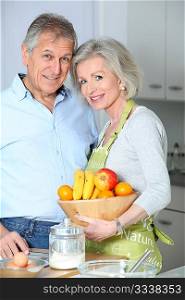Closeup of happy senior couple in kitchen