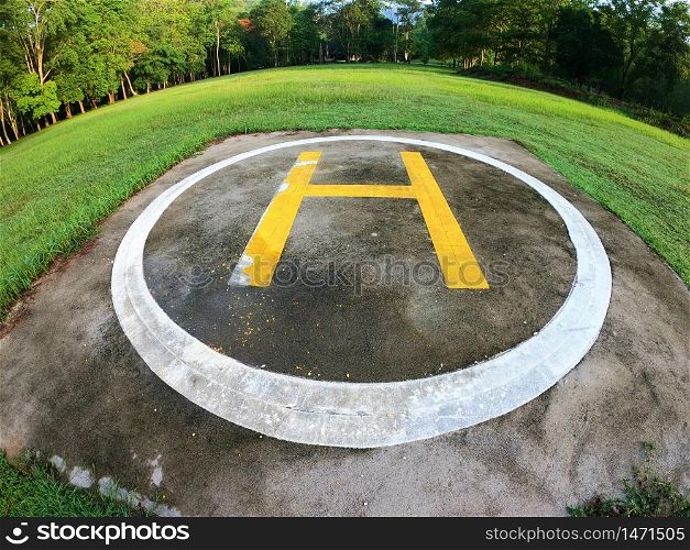 Closeup of helipad for landing helicopters on asphalt ground