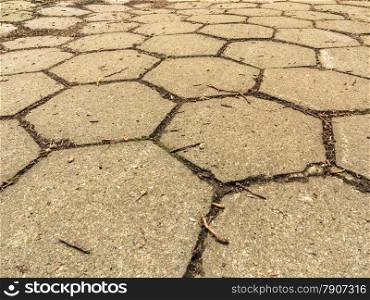 closeup of hexagonal pattern stone sidewalk pavement grey texture background