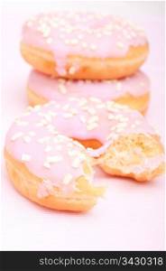 Closeup of Homemade Donuts with Pink Icing - Shallow Depth of Field