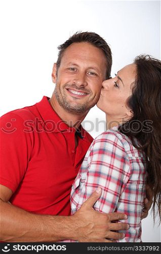 Closeup of in loved couple kissing on white background